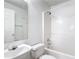 Clean, bright bathroom with a white vanity, toilet, and tub/shower combo at 50989 Highway 27 # 174, Davenport, FL 33897