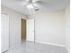 Well-lit bedroom with tile flooring and ceiling fan at 50989 Highway 27 # 174, Davenport, FL 33897