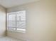 Bright bedroom with neutral walls, tiled floors, and a large window at 50989 Highway 27 # 174, Davenport, FL 33897