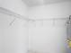 Walk in closet with wire shelving and water heater at 50989 Highway 27 # 174, Davenport, FL 33897
