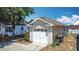 Side view of a well-maintained one car garage attached to the house at 50989 Highway 27 # 174, Davenport, FL 33897