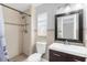 Bathroom featuring a tile shower and modern vanity at 5809 Willow Bud Ct, Orlando, FL 32807