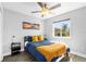 Cozy bedroom featuring a comfortable bed with stylish decor and a bright window at 5809 Willow Bud Ct, Orlando, FL 32807