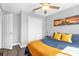 Cozy bedroom featuring neutral walls, ceiling fan, and warm-toned accents at 5809 Willow Bud Ct, Orlando, FL 32807