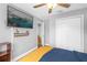 Bright bedroom with a ceiling fan, flat screen tv, and wood-look floors at 5809 Willow Bud Ct, Orlando, FL 32807