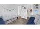 Bright bedroom featuring a white crib, stylish décor, and closet, perfect for a or Bedroom at 5809 Willow Bud Ct, Orlando, FL 32807