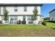 Inviting backyard features a covered patio perfect for outdoor dining and relaxation at 646 Longboat Dr, Davenport, FL 33896
