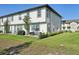 Spacious backyard featuring a well-maintained lawn and a patio with outdoor seating at 646 Longboat Dr, Davenport, FL 33896