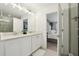 Bathroom featuring double sinks, shower and an adjoining bedroom at 646 Longboat Dr, Davenport, FL 33896