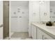 Bathroom featuring double sinks, modern fixtures, and a walk-in shower at 646 Longboat Dr, Davenport, FL 33896