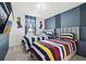 bedroom featuring two twin beds with colorful striped bedding and Mario-themed decorations at 646 Longboat Dr, Davenport, FL 33896
