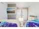 Bright ' room with two themed beds, a mounted TV, and modern decor at 646 Longboat Dr, Davenport, FL 33896
