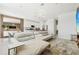 Bright, modern living room seamlessly connected to the kitchen, featuring stylish decor and ample seating at 646 Longboat Dr, Davenport, FL 33896