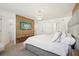 Spacious primary bedroom with a wood accent wall and ensuite bathroom at 646 Longboat Dr, Davenport, FL 33896