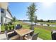Enjoy serene water views from the outdoor patio with dining set, perfect for relaxing at 646 Longboat Dr, Davenport, FL 33896
