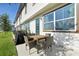 Enjoy the backyard and outdoor patio, equipped with a grill and dining table at 646 Longboat Dr, Davenport, FL 33896