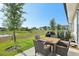 Enjoy serene water views from the outdoor patio with dining set, perfect for relaxing at 646 Longboat Dr, Davenport, FL 33896