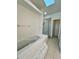 Bathroom featuring a tub, walk-in shower, and a single sink vanity at 658 Caribbean Dr, Davenport, FL 33897