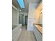 Bathroom featuring a tub, walk-in shower, and a single sink vanity at 658 Caribbean Dr, Davenport, FL 33897