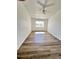 Bedroom featuring wood-look flooring, a ceiling fan, and a window with blinds at 658 Caribbean Dr, Davenport, FL 33897