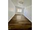 Bedroom featuring wood-look flooring and a window with blinds at 658 Caribbean Dr, Davenport, FL 33897