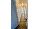 Hallway with wood-look flooring leads to rooms at 658 Caribbean Dr, Davenport, FL 33897