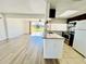 Open-concept kitchen with granite countertops and stainless steel appliances, with view of the backyard at 658 Caribbean Dr, Davenport, FL 33897