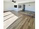 Spacious open-concept living room with modern vinyl floors with kitchen view at 658 Caribbean Dr, Davenport, FL 33897