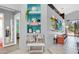 Inviting hallway with decorative niches, stylish decor, and tiled floors with accents at 715 Troon Cir, Davenport, FL 33897