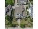Aerial view of a home with a well-manicured front yard, landscaping and a brick pathway to the front door at 795 W Canton Ave, Winter Park, FL 32789