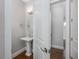 Powder room with pedestal sink, chrome fixtures, and private toilet area at 795 W Canton Ave, Winter Park, FL 32789