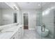 Bright, renovated bathroom with double vanity, walk-in shower, and soaking tub at 795 W Canton Ave, Winter Park, FL 32789