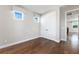 Neutral bedroom with wood floors, double closets, and two windows providing natural light at 795 W Canton Ave, Winter Park, FL 32789