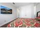 Cozy bedroom featuring a mounted TV, double closets, and hardwood floors for a warm ambiance at 795 W Canton Ave, Winter Park, FL 32789