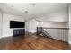Bright bonus room with hardwood floors and staircase with wrought iron spindles at 795 W Canton Ave, Winter Park, FL 32789