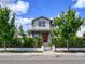 Charming two-story home with a brick pathway leading to a red front door and landscaped front yard at 795 W Canton Ave, Winter Park, FL 32789