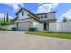 Beautiful two-story home featuring an attached two car garage and a white privacy fence at 795 W Canton Ave, Winter Park, FL 32789