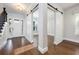 Inviting foyer with hardwood floors, sliding barn doors, and ample natural light from the front door at 795 W Canton Ave, Winter Park, FL 32789