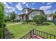 Well-maintained front yard with lush green grass, mature landscaping, and a brick pathway leading to the entrance at 795 W Canton Ave, Winter Park, FL 32789