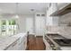 Well-equipped kitchen with stainless steel appliances and an island with a sink at 795 W Canton Ave, Winter Park, FL 32789