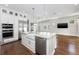 Bright kitchen features a large center island, stainless steel appliances, and wood flooring at 795 W Canton Ave, Winter Park, FL 32789