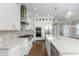 Spacious kitchen features stainless steel appliances, a center island, and a tiled backsplash at 795 W Canton Ave, Winter Park, FL 32789