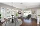 Inviting living and dining area with hardwood floors, large windows, and sliding glass doors to the backyard at 795 W Canton Ave, Winter Park, FL 32789