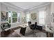 Home office with hardwood floors, large windows, and contemporary furnishings at 795 W Canton Ave, Winter Park, FL 32789