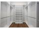 Walk-in closet with custom shelving and hardwood floors at 795 W Canton Ave, Winter Park, FL 32789