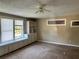 Bedroom with built-in shelving, a ceiling fan, and a large window overlooking the yard at 804 Little Wekiwa Dr, Altamonte Springs, FL 32714