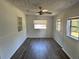 Bright bedroom featuring a ceiling fan, neutral walls, and multiple windows for ample natural light at 804 Little Wekiwa Dr, Altamonte Springs, FL 32714