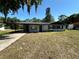 Charming single-story home with a covered carport and mature trees shading the front yard at 804 Little Wekiwa Dr, Altamonte Springs, FL 32714