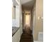 Hallway connecting to rooms with neutral walls and white trim, with the kitchen on the left at 804 Little Wekiwa Dr, Altamonte Springs, FL 32714