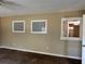 Living space with a view into the kitchen, carpeted floors, and neutral walls at 804 Little Wekiwa Dr, Altamonte Springs, FL 32714